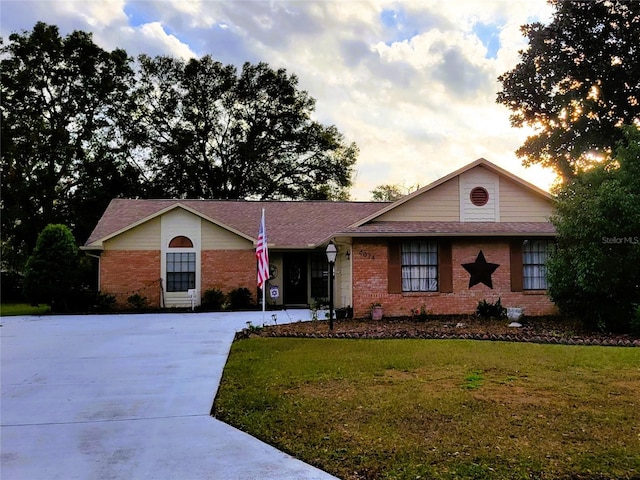 ranch-style house with a lawn