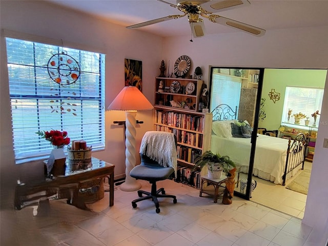 living area featuring ceiling fan