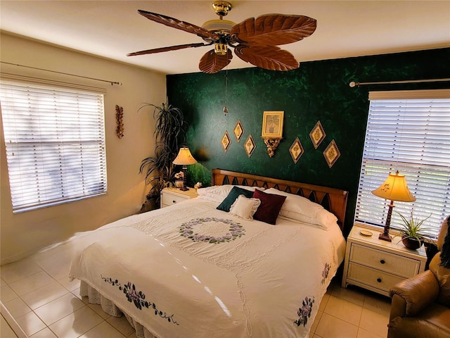 bedroom featuring ceiling fan and light tile patterned floors