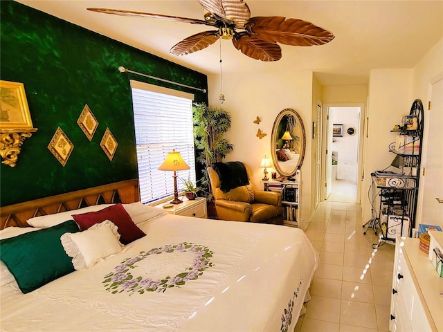 tiled bedroom with ceiling fan