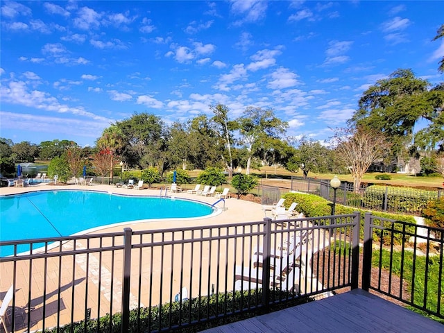 view of swimming pool with a patio area