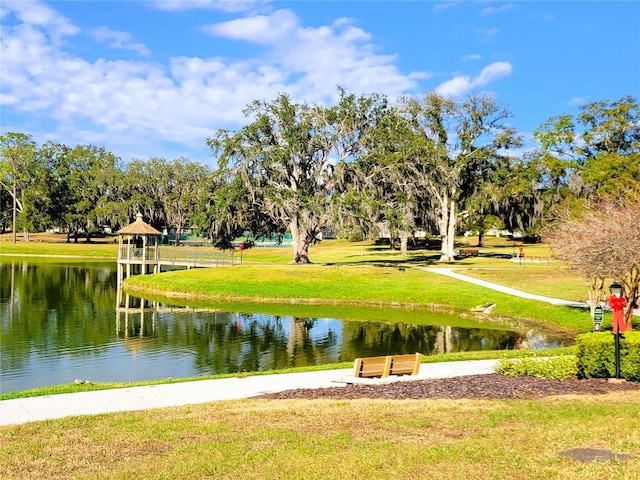 view of property's community featuring a gazebo, a yard, and a water view