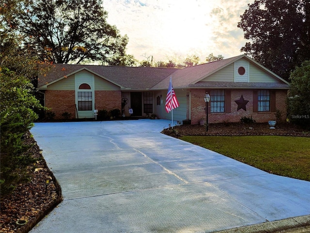 ranch-style house featuring a yard