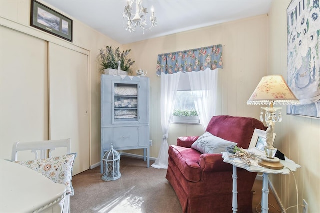 sitting room with carpet and a chandelier