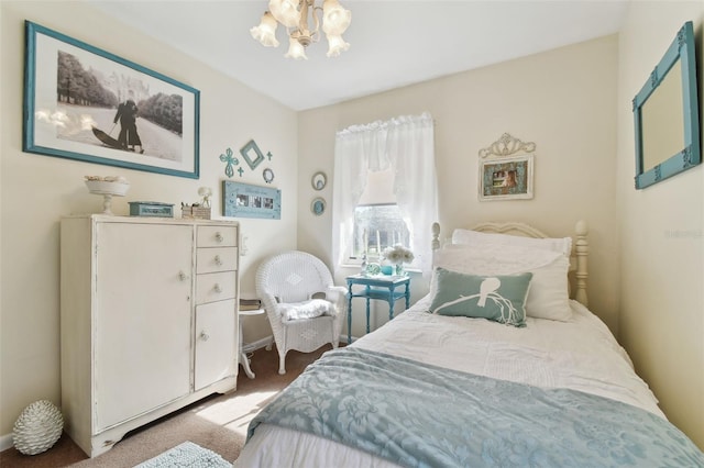 carpeted bedroom with an inviting chandelier