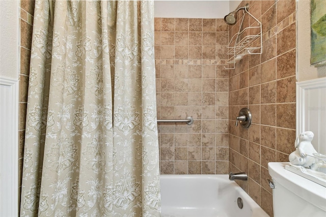 bathroom with toilet and shower / bath combo with shower curtain