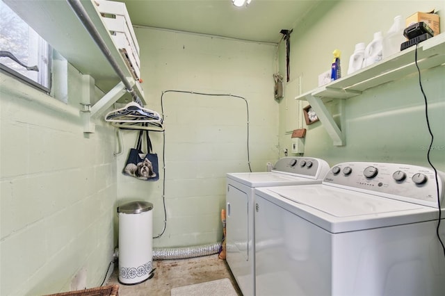 clothes washing area featuring washing machine and clothes dryer