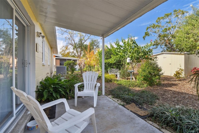 view of patio / terrace featuring a storage unit and central AC