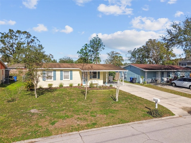 ranch-style home featuring a carport, central air condition unit, and a front yard