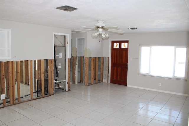 entrance foyer with ceiling fan and light tile patterned floors