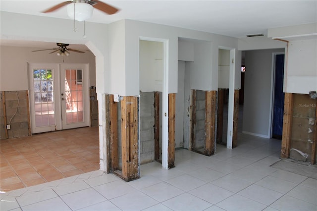 interior space featuring ceiling fan and french doors