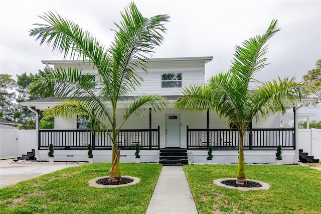 view of front of house with a front lawn and covered porch