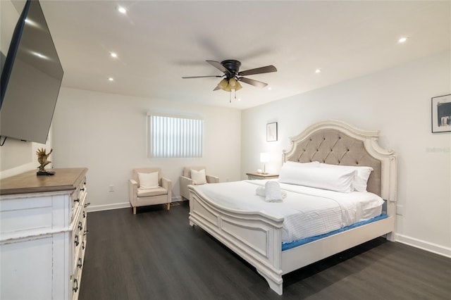 bedroom with ceiling fan and dark hardwood / wood-style flooring