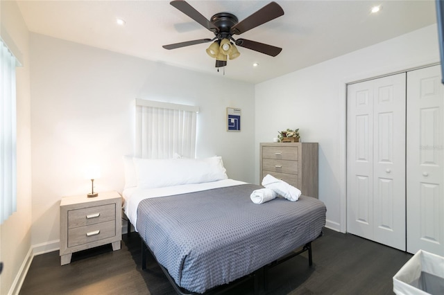 bedroom featuring dark hardwood / wood-style flooring, a closet, and ceiling fan