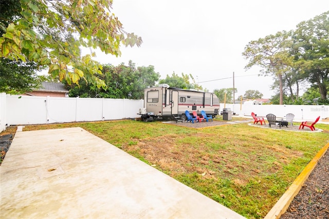 view of yard with a patio and a fire pit