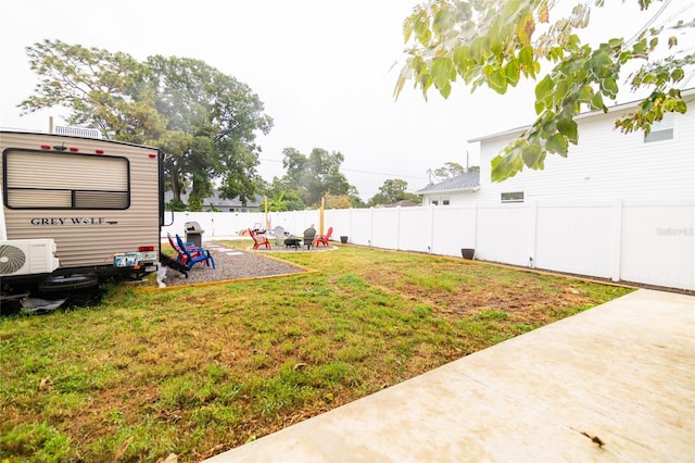 view of yard featuring ac unit and a patio