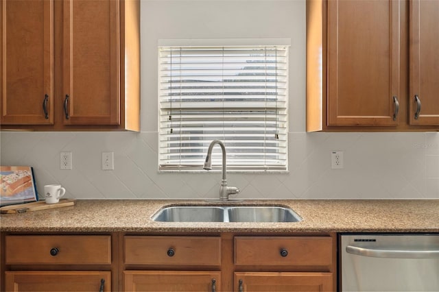 kitchen with dishwasher, backsplash, and sink