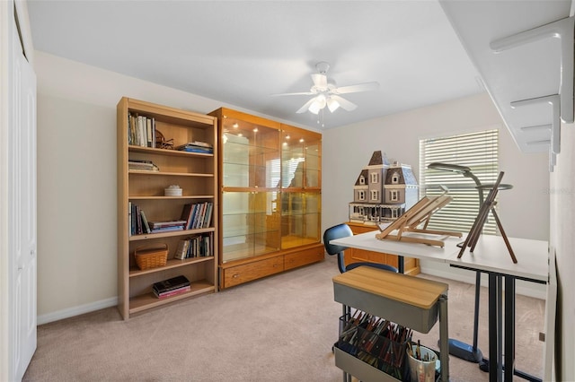 misc room featuring carpet flooring and ceiling fan