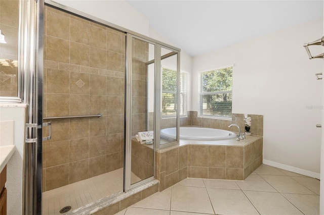 bathroom with lofted ceiling, tile patterned floors, and separate shower and tub