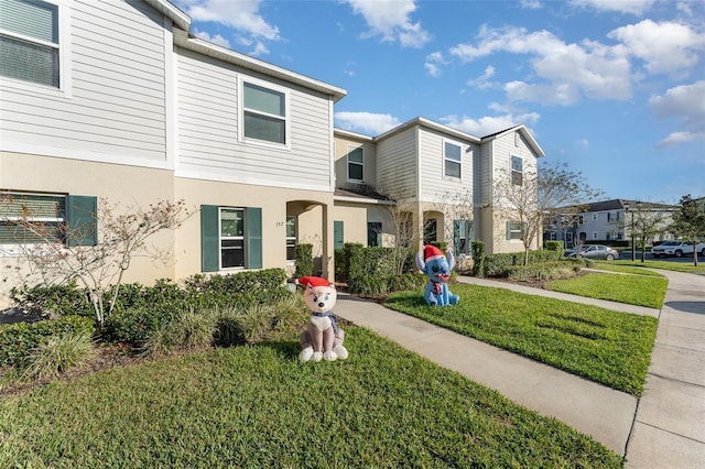 view of front of property with a front lawn