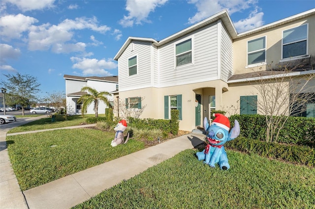 view of property with a front lawn