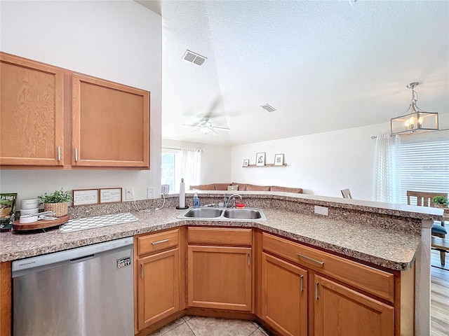 kitchen with ceiling fan with notable chandelier, sink, hanging light fixtures, stainless steel dishwasher, and kitchen peninsula