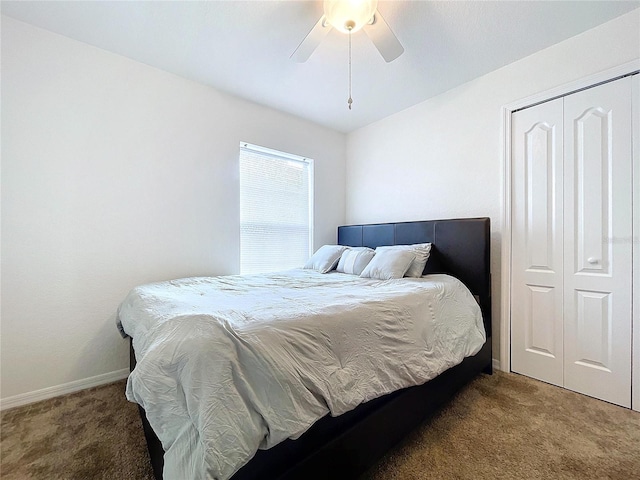 carpeted bedroom featuring a closet and ceiling fan