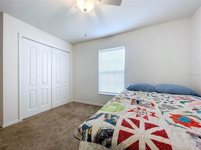 carpeted bedroom featuring a closet and ceiling fan