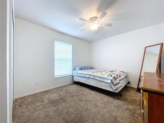 bedroom featuring ceiling fan and carpet floors