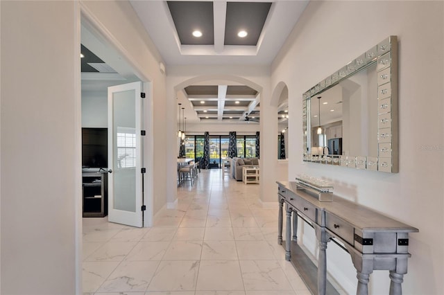 entrance foyer featuring baseboards, coffered ceiling, beamed ceiling, marble finish floor, and recessed lighting