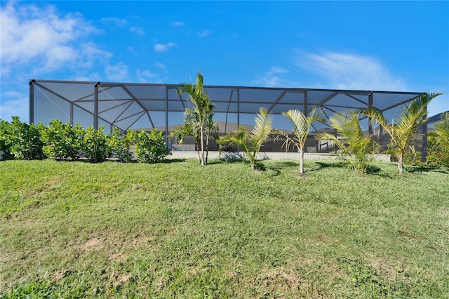 view of yard with glass enclosure