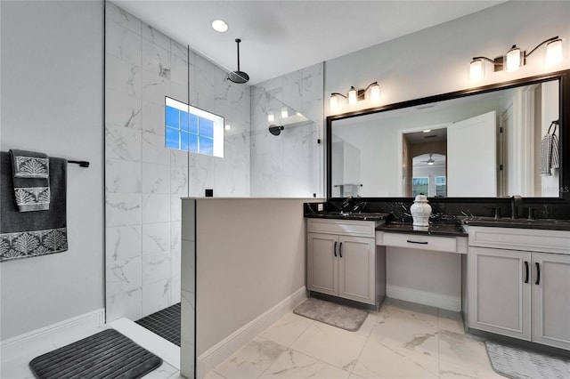 full bathroom featuring double vanity, marble finish floor, walk in shower, and a sink