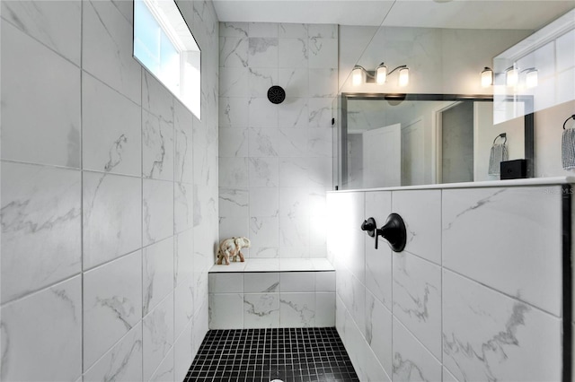 full bath with tile walls and walk in shower