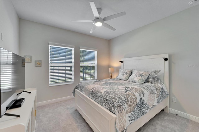 bedroom with carpet floors, baseboards, and a ceiling fan