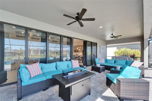 view of patio / terrace with an outdoor living space and a ceiling fan