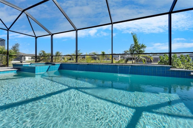 view of swimming pool with a pool with connected hot tub and glass enclosure