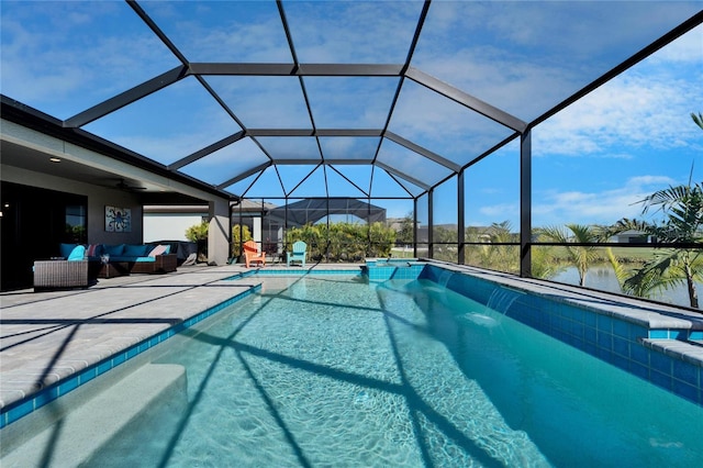 outdoor pool featuring glass enclosure, a patio area, outdoor lounge area, and ceiling fan