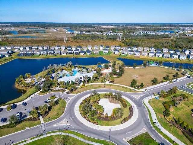 bird's eye view featuring a water view and a residential view