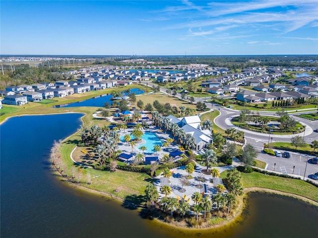 bird's eye view featuring a residential view and a water view