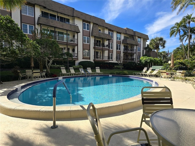 view of swimming pool with a patio area