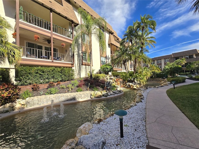 view of community with a water view