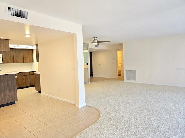 carpeted empty room with ceiling fan