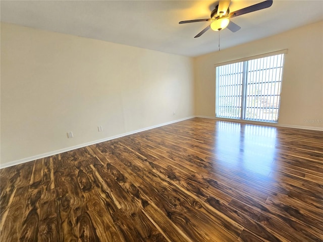 unfurnished room featuring ceiling fan and dark wood-type flooring