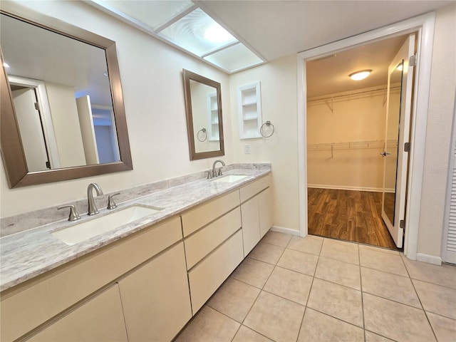 bathroom with tile patterned flooring and vanity