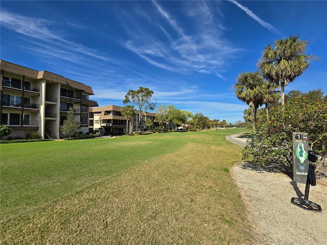 view of home's community featuring a lawn