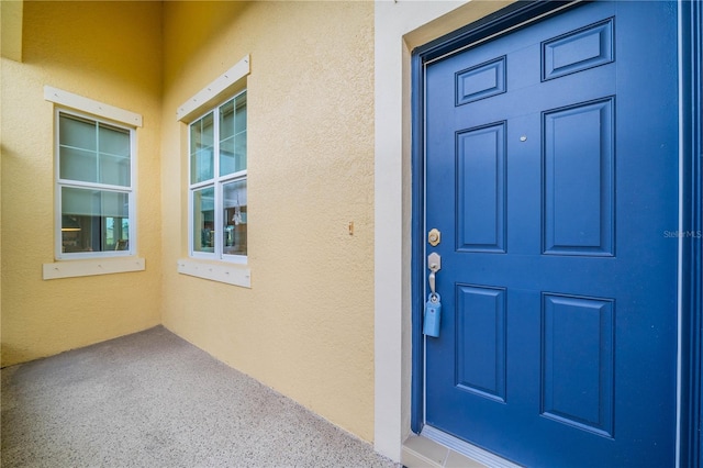 entrance to property featuring a porch