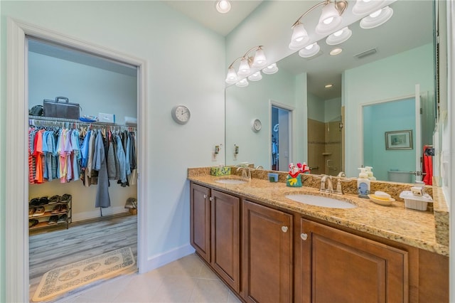 bathroom with tile patterned flooring, vanity, and toilet