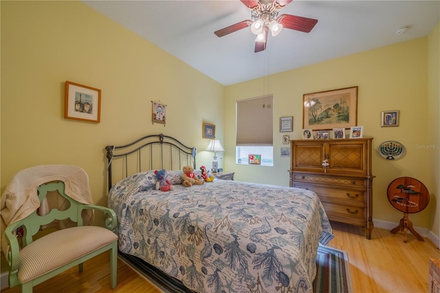 bedroom featuring ceiling fan and light wood-type flooring