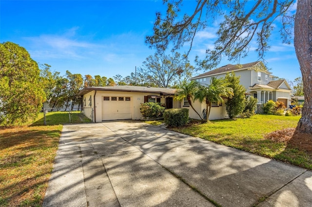 view of front of house with a garage and a front yard