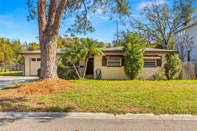 view of front facade featuring a front yard and a garage